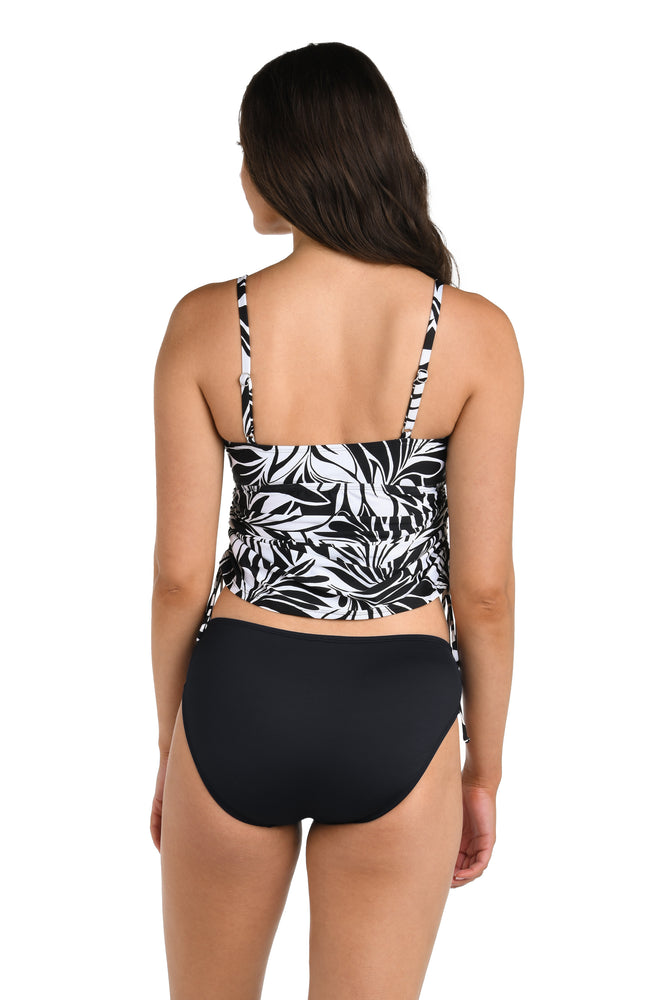 Back image of model wearing the 24th & Ocean Floating Palms Side Shirred Tankini Top.