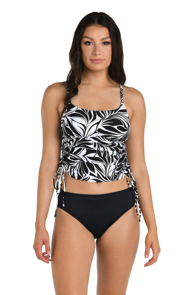 Front image of model wearing the 24th & Ocean Floating Palms Side Shirred Tankini Top.