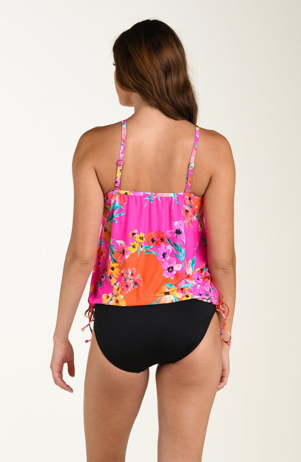 Back image of model wearing a multicolored pink floral printed tankini top featuring a relaxed, flowy fit with adjustable straps, straight back, and a drawstring hem for customizable style. This is paired with solid black colored bikini bottoms.