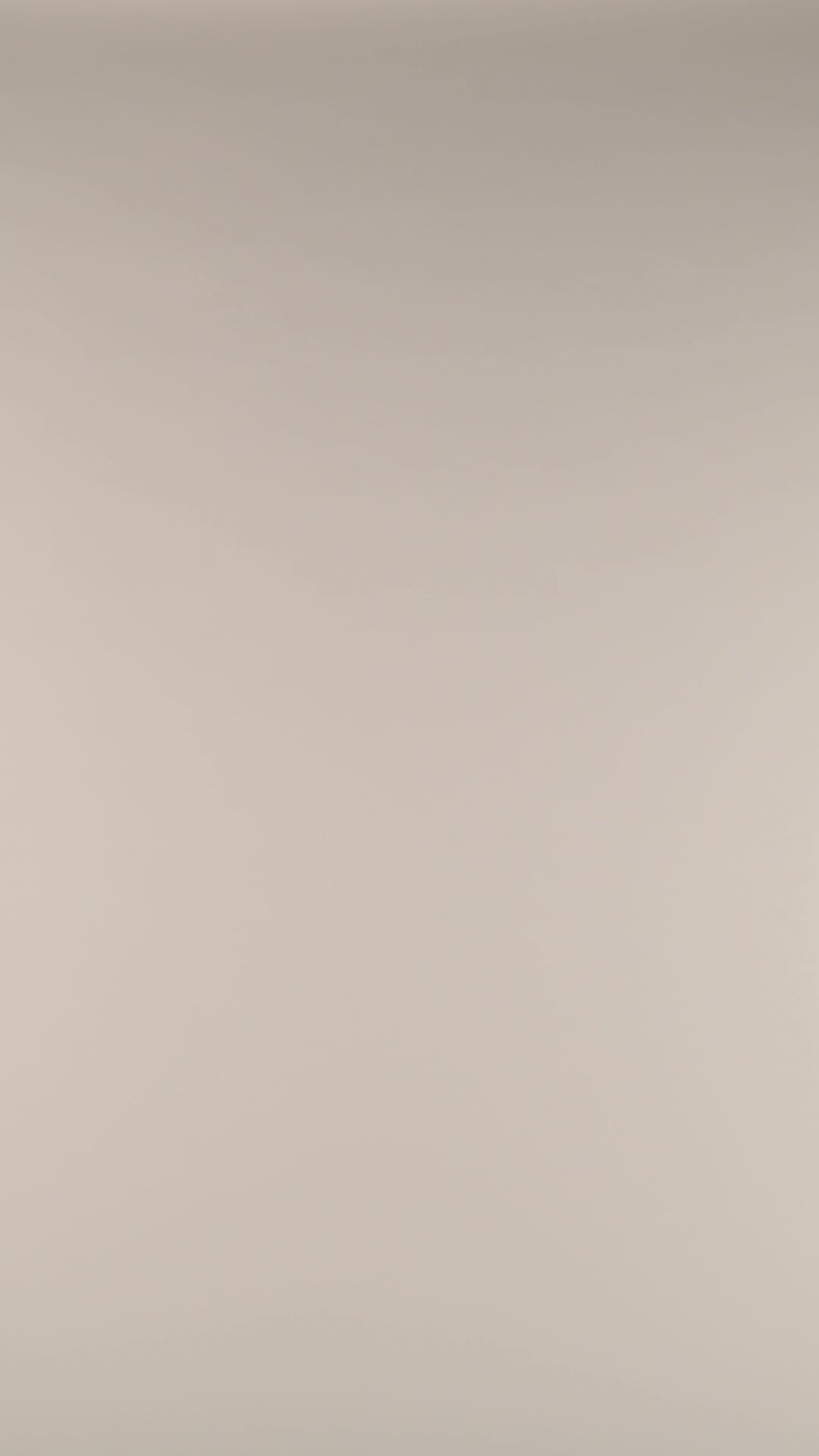 Studio video of model wearing a multicolored tropical printed one-piece swimsuit featuring a halter neckline with a keyhole front cutout and tummy control.