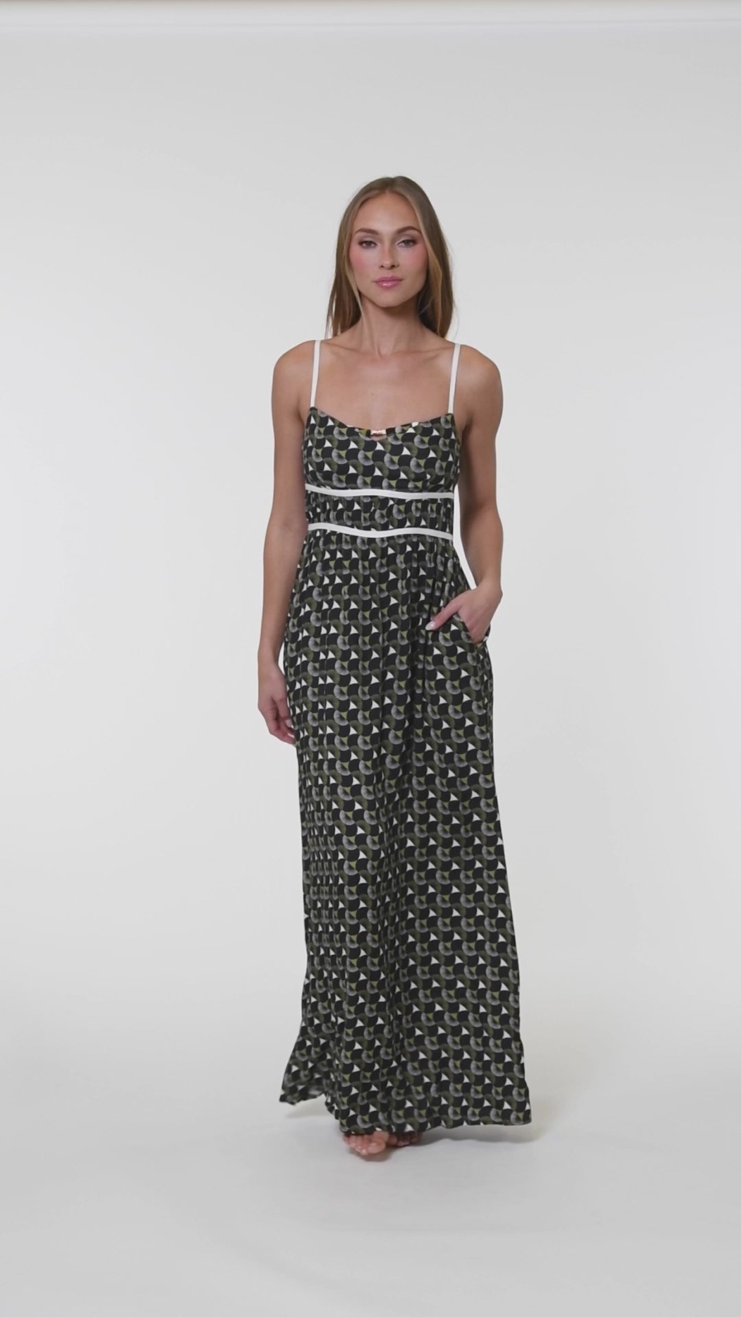 Video of model wearing a black and white geometric printed maxi dress cover up. 
