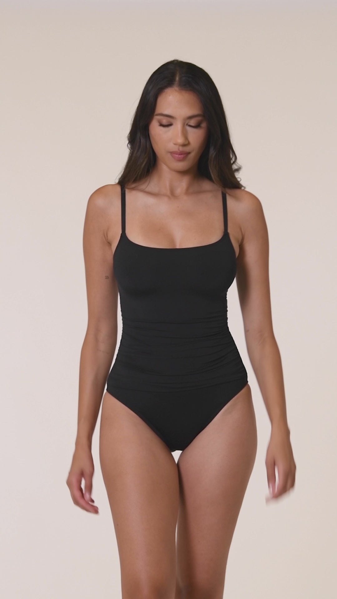 Model is wearing a black one piece swimsuit from our Best-Selling Island Goddess collection.