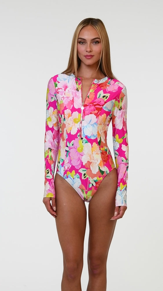 
                  
                    Load and play video in Gallery viewer, Model is wearing a colorful floral paddlesuit one piece from the Sunshine 79 Expressive Garden Collection
                  
                