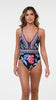 Model is wearing the La Blanca Midnight Magic Plunge One Piece.