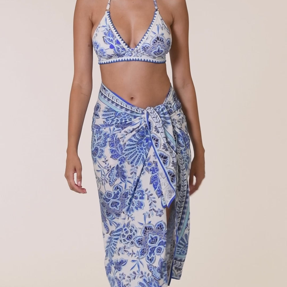 
                  
                    Load and play video in Gallery viewer, Model is wearing an indigo and white multicolored floral printed Banded Halter Triangle Top
                  
                