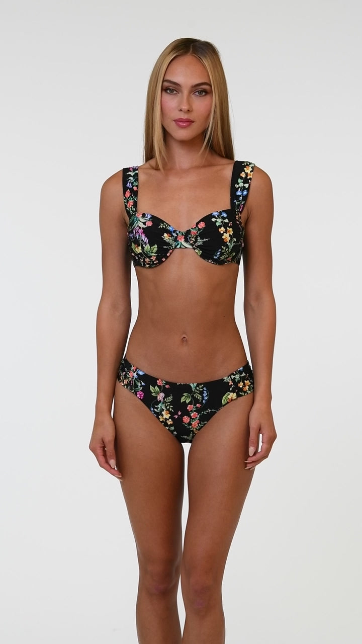 Model is wearing a matching Wildflower Vines bikini top and swimsuit bottom