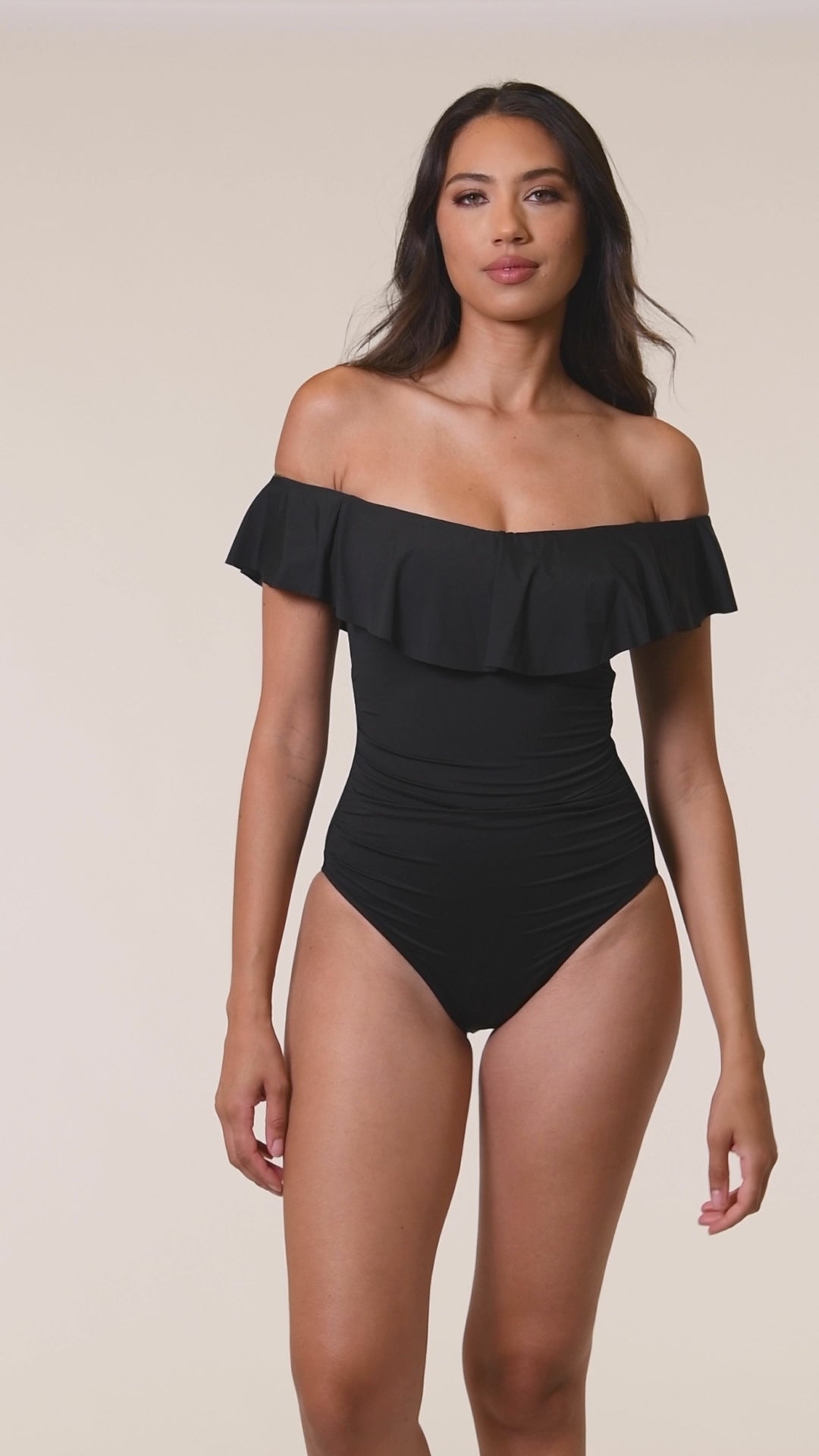 Model is wearing a black one piece swimsuit from our Best-Selling Island Goddess collection.