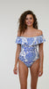Model is wearing the La Blanca Beyond the Pacific Off Shoulder Ruffle One Piece.
