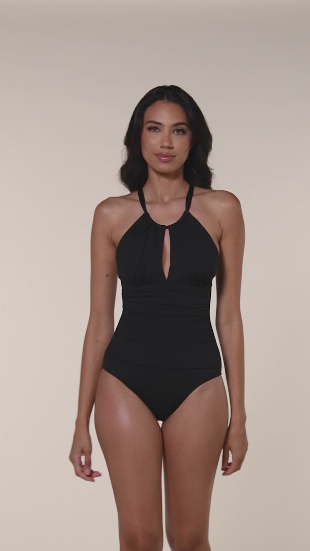 More ways to wear. This is a video of model showcasing how to pull the front neck strap over the head to convert this one piece from a halter to an over the shoulder strap look.