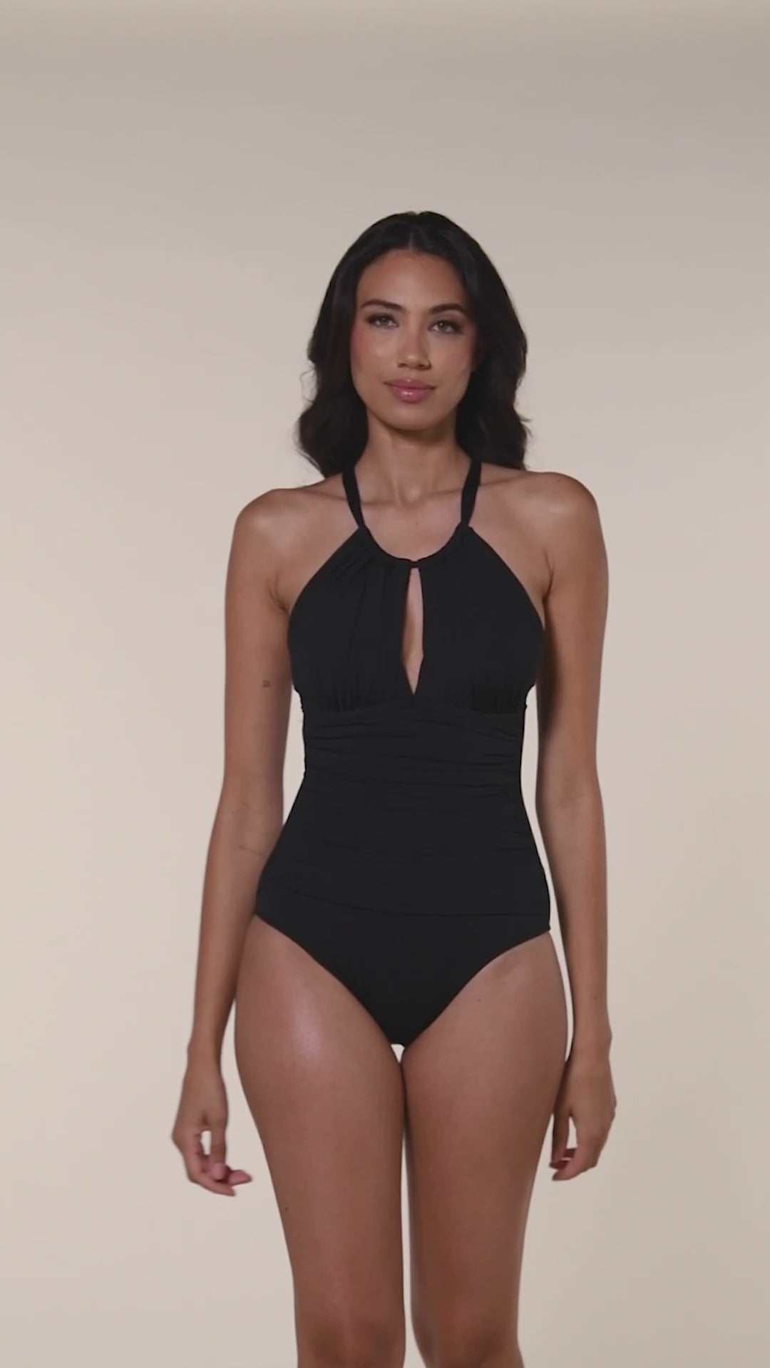 More ways to wear. This is a video of model showcasing how to pull the front neck strap over the head to convert this one piece from a halter to an over the shoulder strap look.