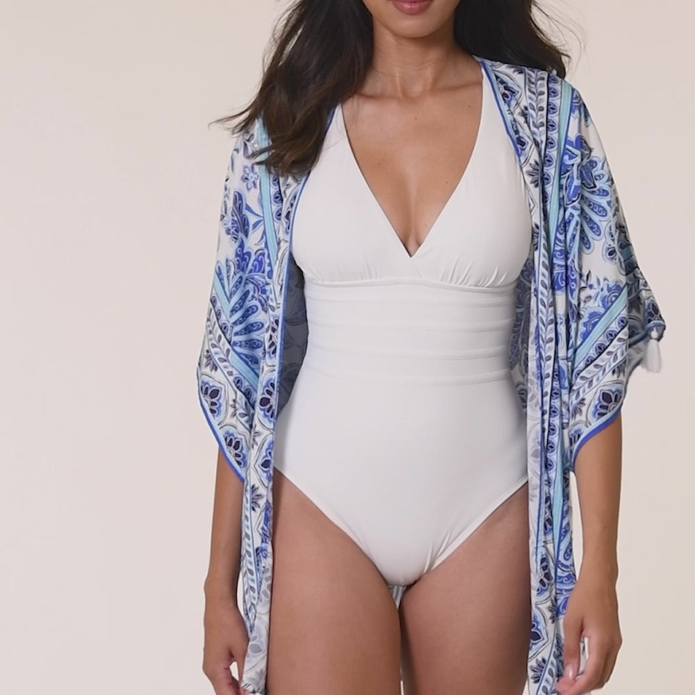 
                  
                    Load and play video in Gallery viewer, Model is wearing an indigo and white multicolored floral printed Kimono Cover Up
                  
                