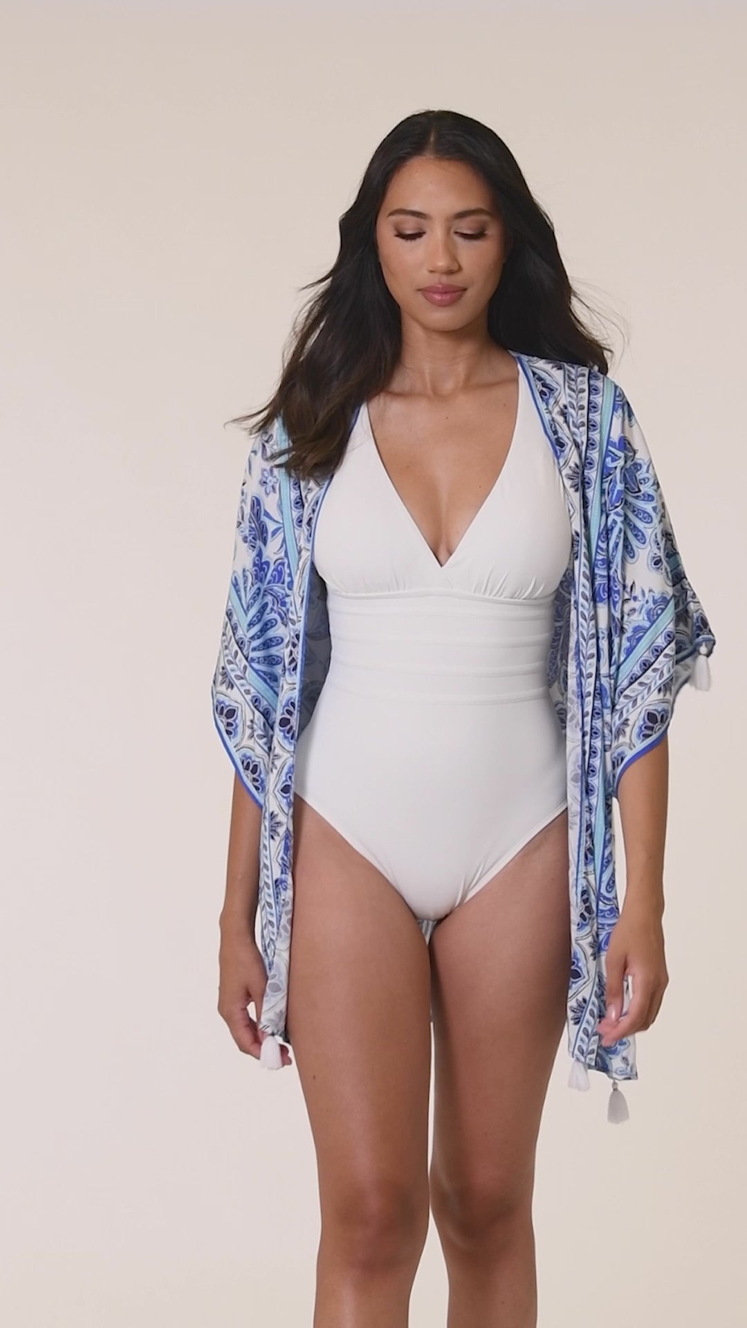 Model is wearing an indigo and white multicolored floral printed Kimono Cover Up