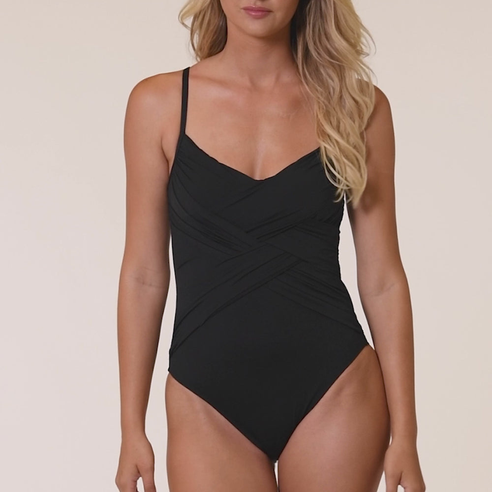 
                  
                    Load and play video in Gallery viewer, Model is wearing a solid black Island Goddess Draped Lingerie One Piece Swimsuit
                  
                