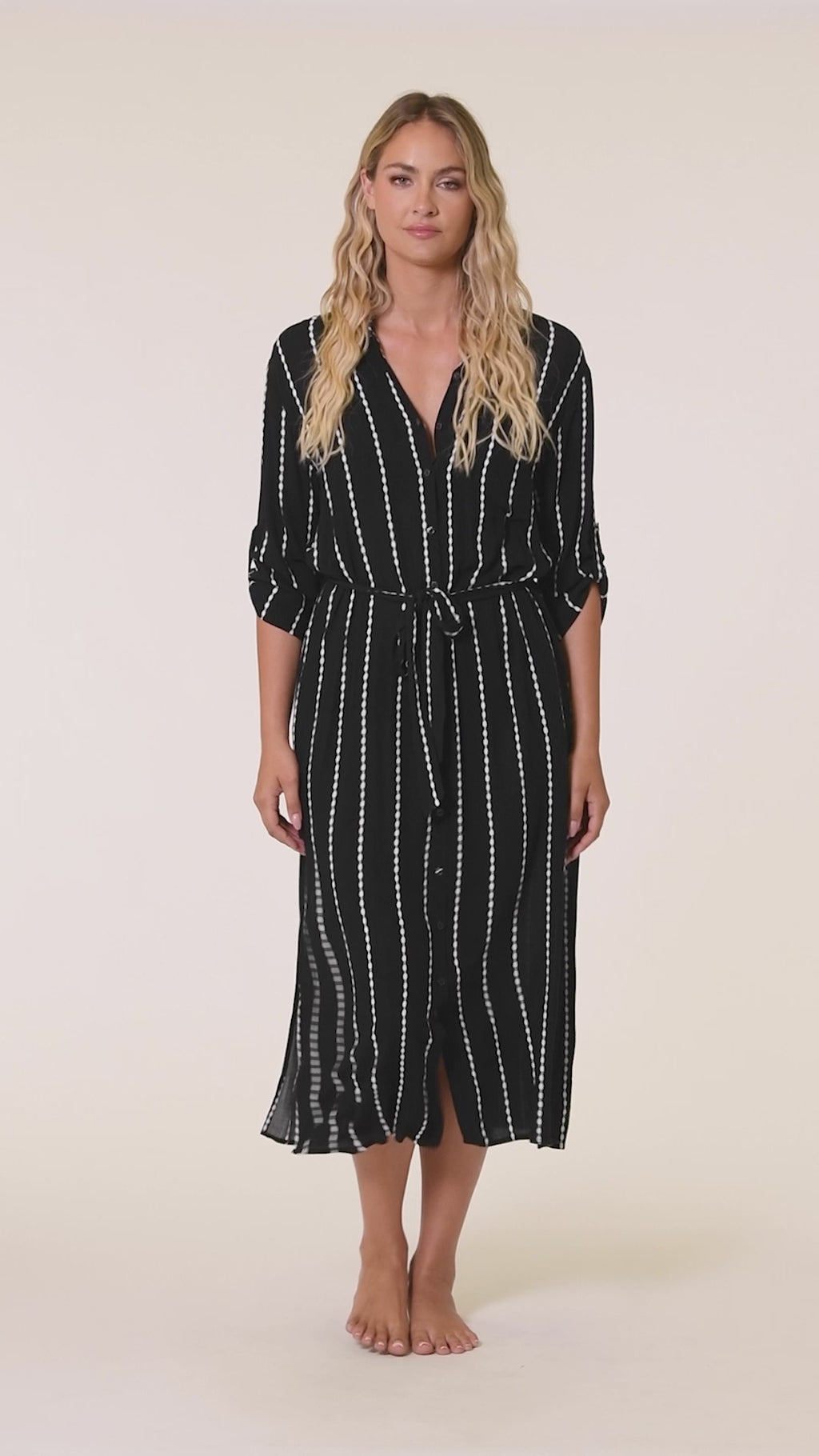 Video of model wearing the City Lights Button Up Shirt Dress.