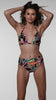 Model is wearing a multicolored Twist Front High Waist Bikini Bottom