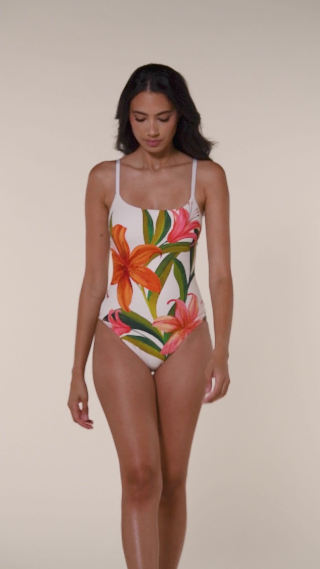 Woman wearing a floral one piece swimsuit