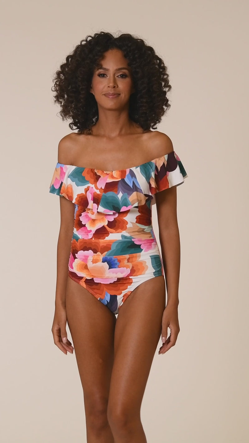 
                  
                    Load and play video in Gallery viewer, This is a video of a Model is wearing a multi colored floral printed off shoulder ruffle one piece from our Floral Rhythm collection!
                  
                