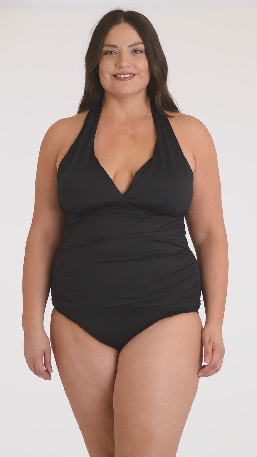 This is a video of a Model is wearing a black halter tankini swimsuit top from our Best-Selling Island Goddess collection.