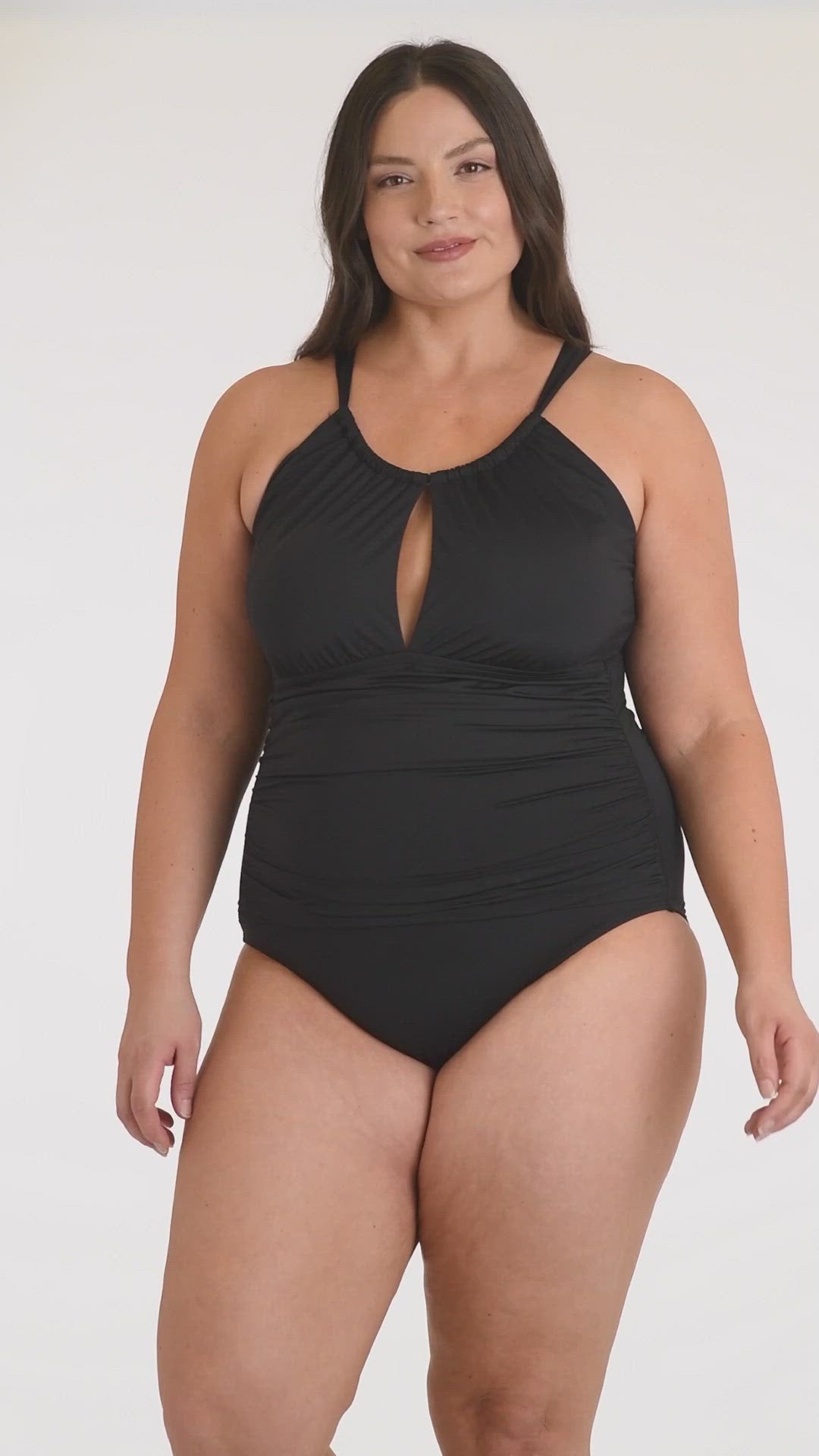 This is a video of a Model is wearing a black one piece swimsuit from our Best-Selling Island Goddess collection.