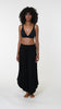 This is a video of a Model is wearing a black palazzo pant swimsuit cover up from our Draped Darling collection.