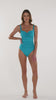 This is a video of a Model is wearing a turquoise colored one piece swimsuit from our Best-Selling Island Goddess collection.