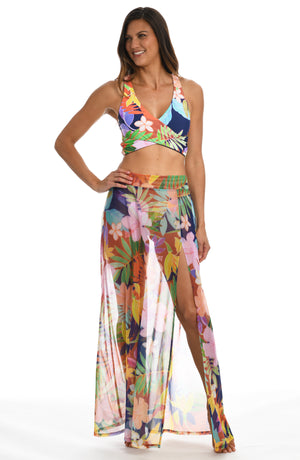 Model is wearing a multi-colored tropical maxi skirt swimsuit cover up from our In The Tropics collection!