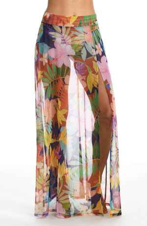 Model is wearing a multi-colored tropical maxi skirt swimsuit cover up from our In The Tropics collection!