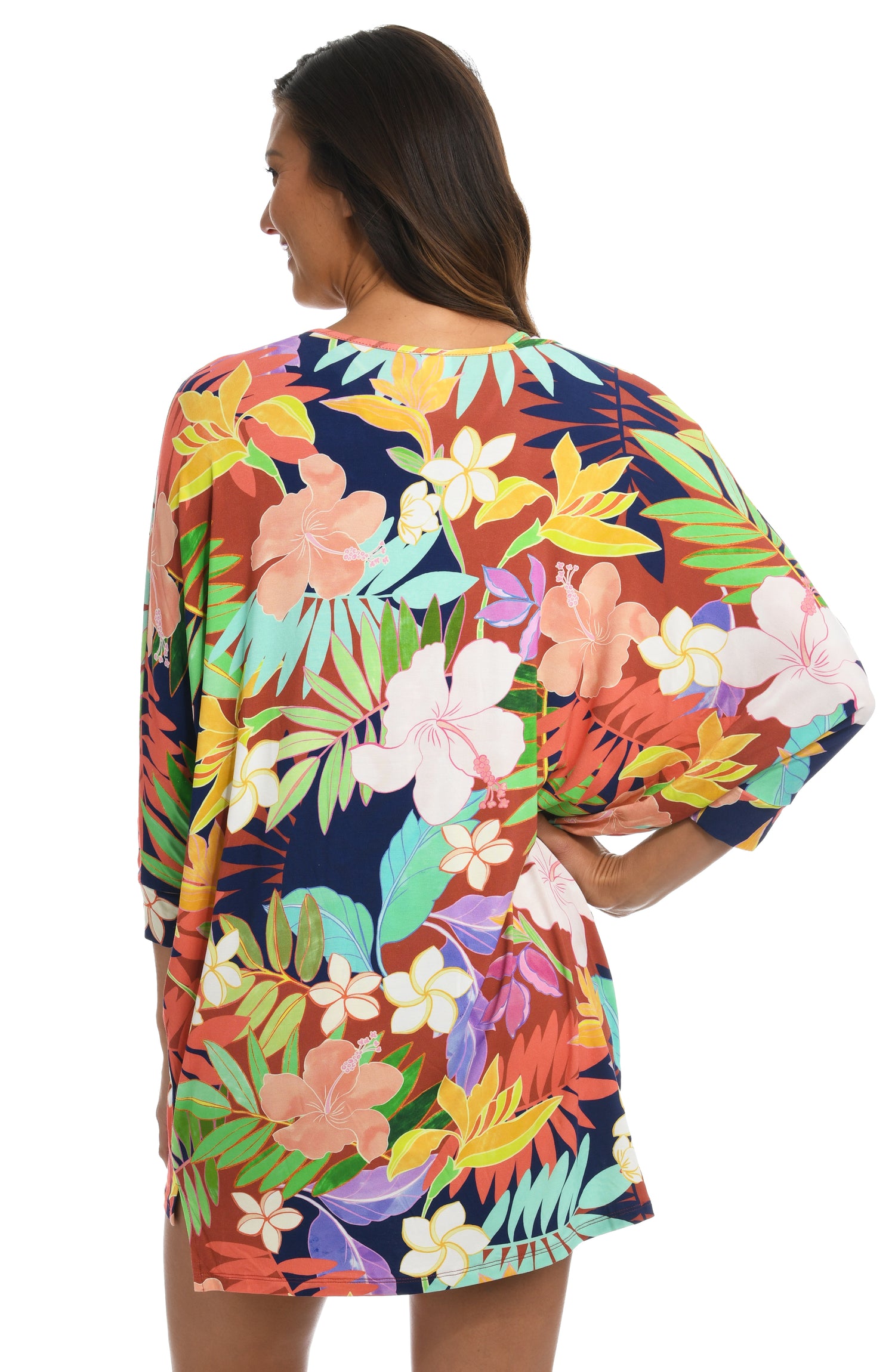 Model is wearing a multi-colored tropical v-neck tunic swimsuit cover up from our In The Tropics collection!