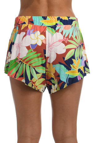 
            
                Load image into Gallery viewer, Model is wearing a multi-colored tropical flounce short swimsuit cover up from our In The Tropics collection!
            
        