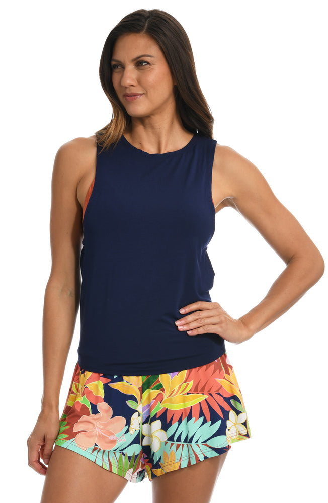 
            
                Load image into Gallery viewer, Model is wearing a multi-colored tropical flounce short swimsuit cover up from our In The Tropics collection!
            
        