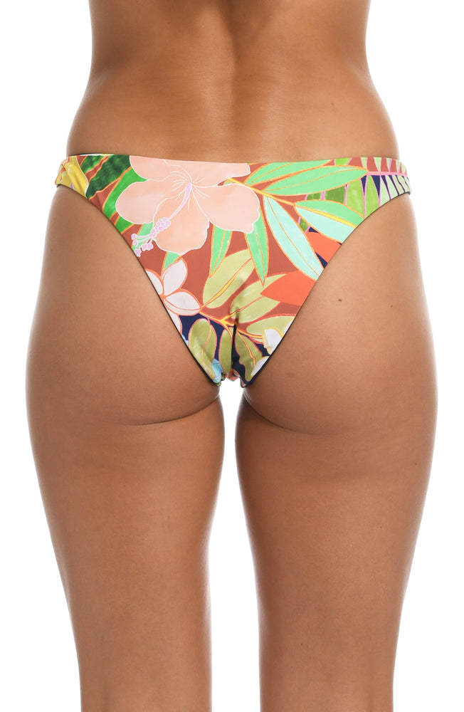 
            
                Load image into Gallery viewer, Model is wearing a multi-colored tropical hipster swimsuit swimsuit bottom from our In The Tropics collection!
            
        