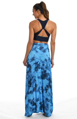 
            
                Load image into Gallery viewer, Model is wearing a blue dreamy cloud-inspired printed maxi skirt swimsuit cover up from our Head in the Clouds collection.
            
        