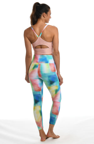 Model is wearing a multi-colored tie-dye inspired high waist legging from our Sunset Tide collection!