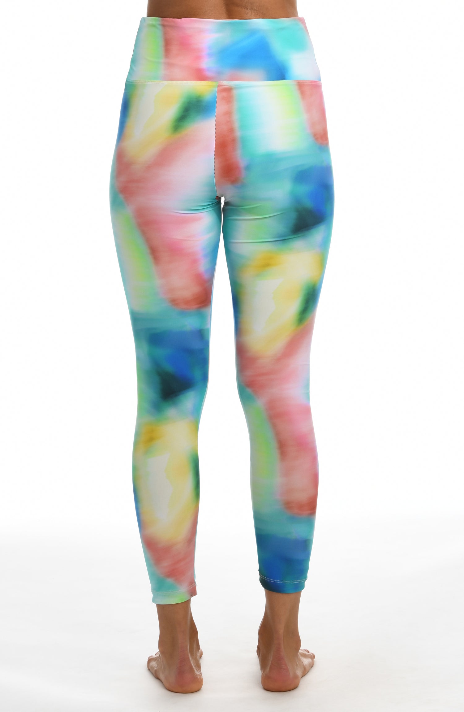 Model is wearing a multi-colored tie-dye inspired high waist legging from our Sunset Tide collection!