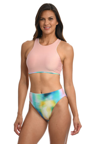 Model is wearing a multi-colored tie-dye inspired midkini top from our Sunset Tide collection!