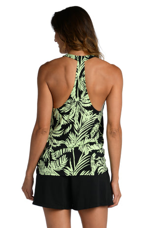 Model is wearing a green and black colored tropical printed tank top from our Abstract Palm collection!