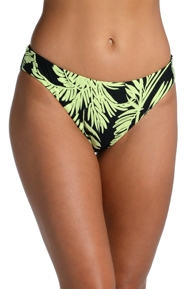 Model is wearing a green and black colored tropical printed hipster bottom from our Abstract Palm collection!