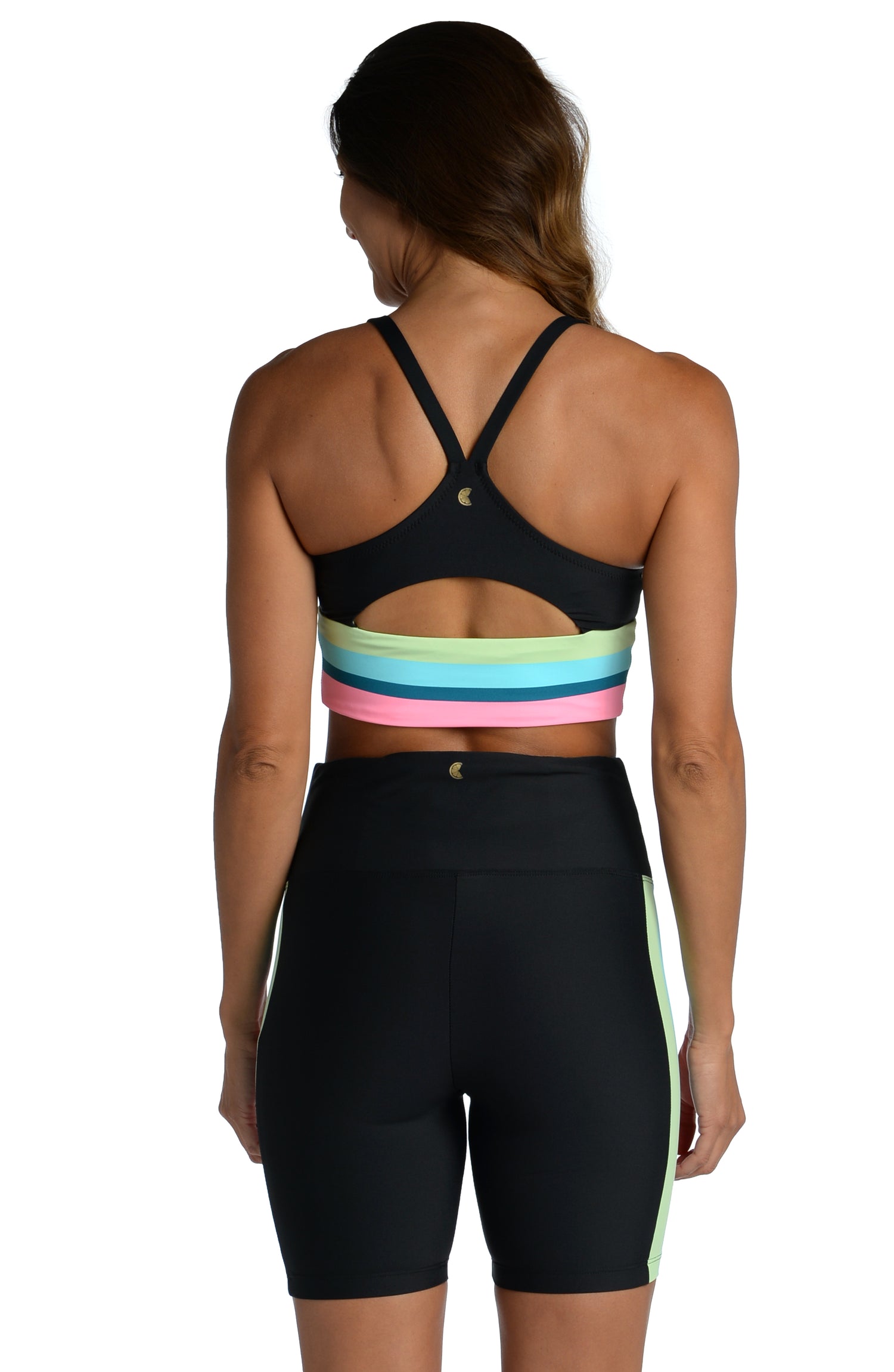 Model is wearing a vibrant colorblock against a solid black ground printed high waist bike short from our Colorblock collection!