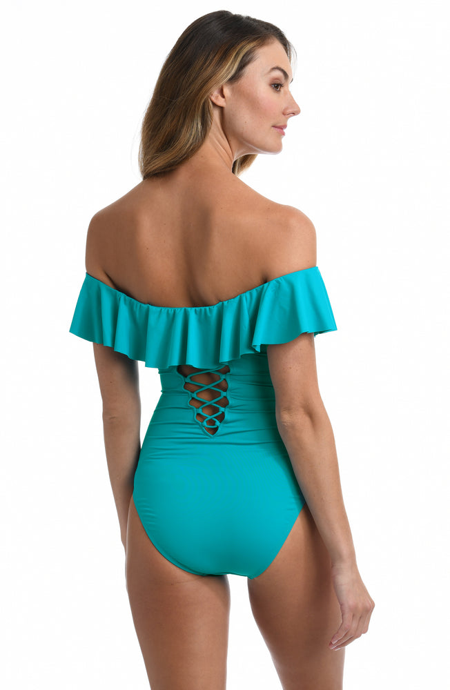 Model is wearing a turquoise colored one piece swimsuit from our Best-Selling Island Goddess collection.