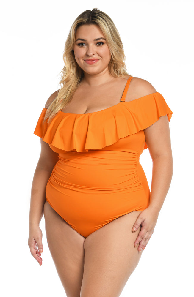 
            
                Load image into Gallery viewer, Model is wearing a tangerine colored one piece swimsuit from our Best-Selling Island Goddess collection.
            
        