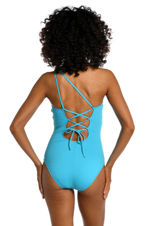 
            
                Load image into Gallery viewer, Model is wearing a azul (light blue) colored one piece swimsuit from our Best-Selling Island Goddess collection.
            
        