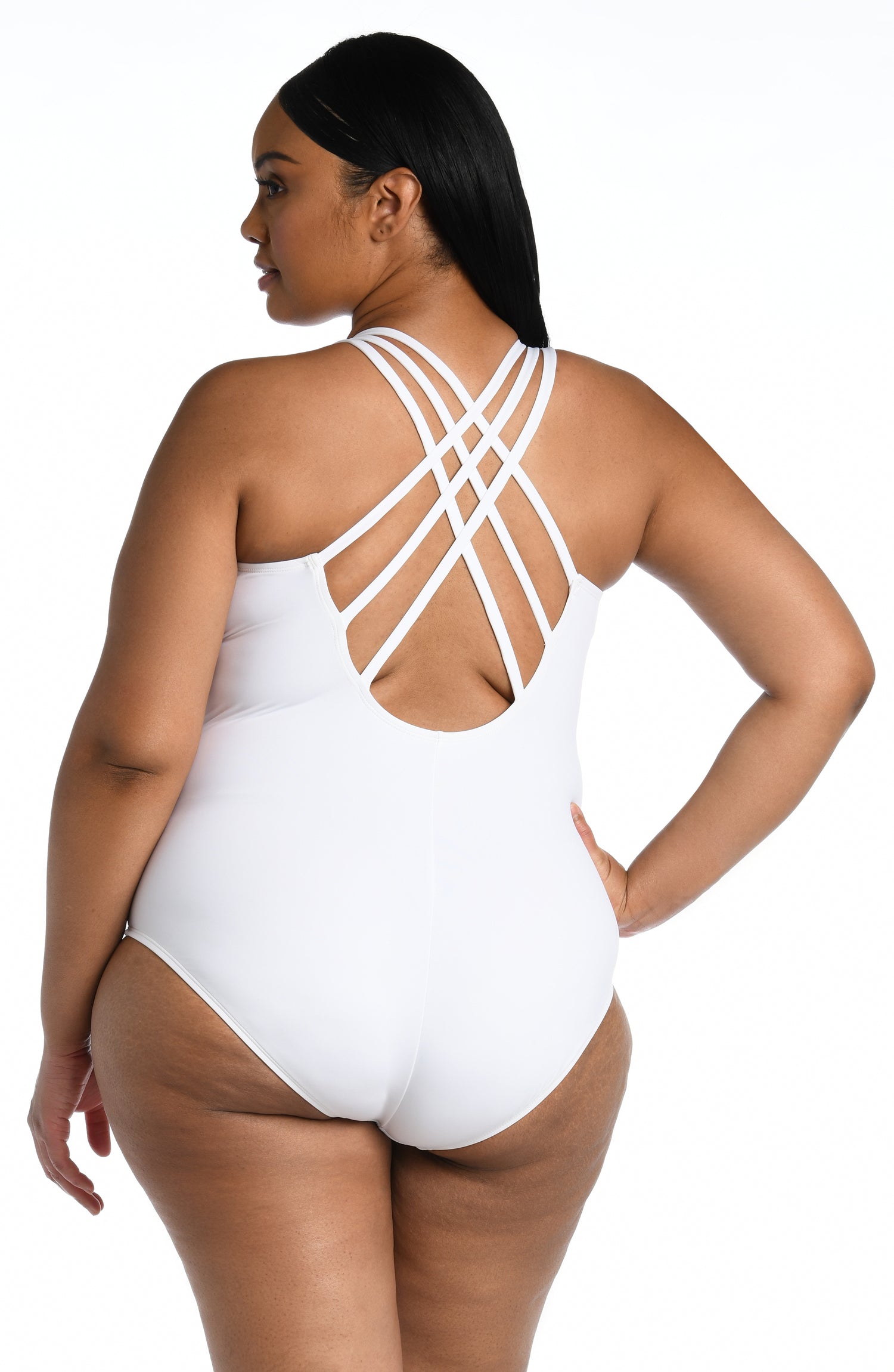 Model is wearing a white one piece swimsuit from our Best-Selling Island Goddess collection.