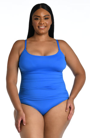 
            
                Load image into Gallery viewer, Model is wearing a capri blue colored one piece swimsuit from our Best-Selling Island Goddess collection.
            
        