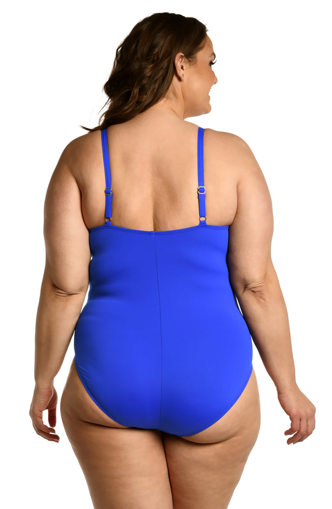 
            
                Load image into Gallery viewer, Model is wearing a sapphire colored one piece swimsuit from our Best-Selling Island Goddess collection.
            
        