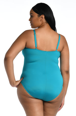 Model is wearing a turquoise colored one piece swimsuit from our Best-Selling Island Goddess collection.