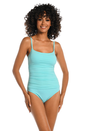 
            
                Load image into Gallery viewer, Model is wearing a ice blue colored one piece swimsuit from our Best-Selling Island Goddess collection.
            
        