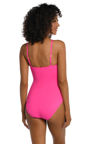 Model is wearing a pop pink colored one piece swimsuit from our Best-Selling Island Goddess collection.