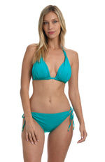 Model is wearing a turquoise colored halter triangle swimsuit top from our Best-Selling Island Goddess collection.