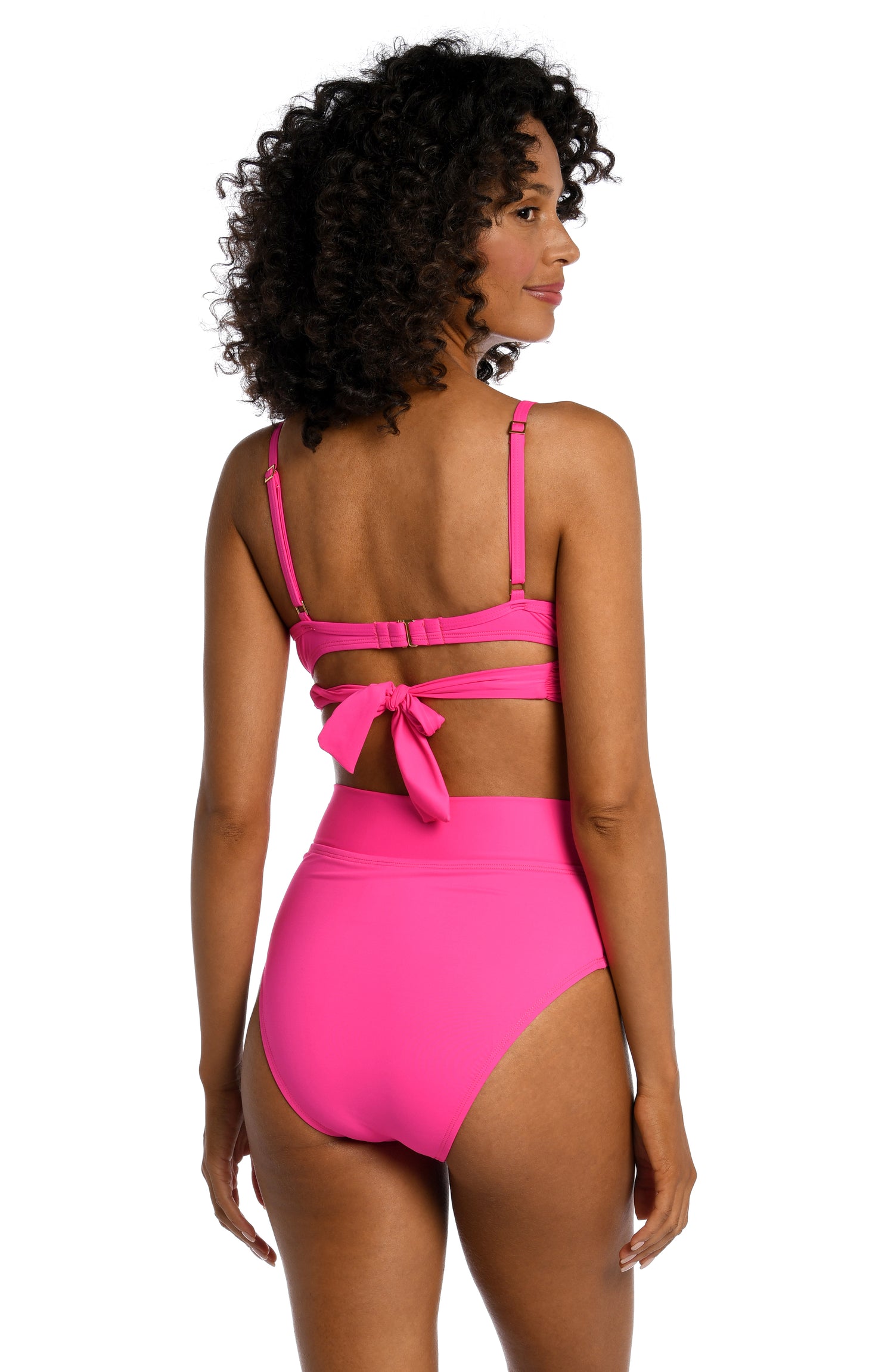 Model is wearing a pop pink colored underwire swimsuit top from our Best-Selling Island Goddess collection.