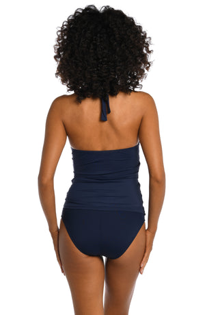Model is wearing a indigo colored halter tankini swimsuit top from our Best-Selling Island Goddess collection.